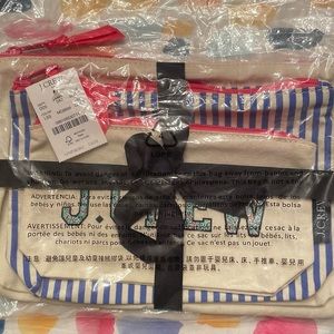 NWT J Crew 3 cosmetic bags, different sizes, colorful with pink zippers.